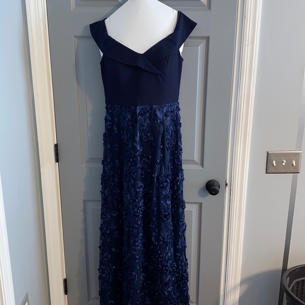 Navy blue gown with beautiful detail.